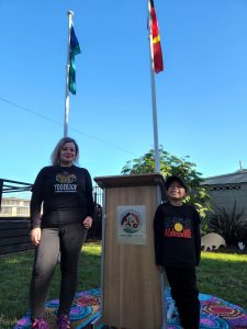 Yoorrook staff member Tara Fry and son Oscar at the Nairm Marr Djambana Flag Raising NAIDOC week 2022