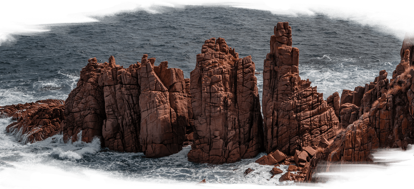 3 pillars of orange rocks towering out of the ocean at Millowl (Phillip Island) - Bunurong Country