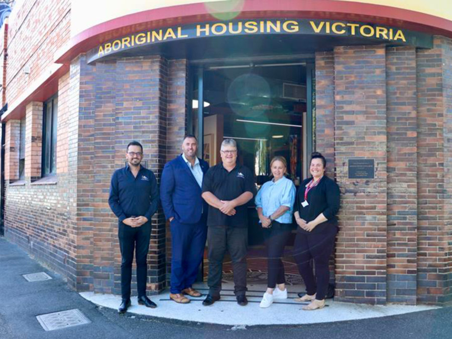 Yoorrook commissioners Sue-Anne Hunter and Travis Lovett meeting with Aboriginal Housing Victoria Staff in front of their offices
