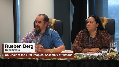 Rueben Berg and Ngarra Murray presenting indoors at a Yoorrook public hearing.